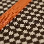 Cotton Turtleneck with Cross Pattern and Orange Sleeves